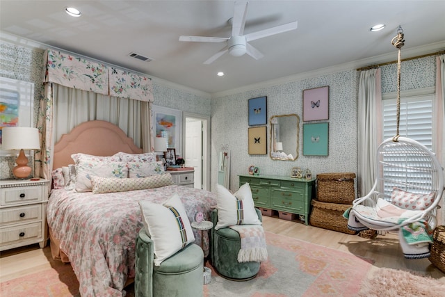 bedroom featuring ornamental molding, light hardwood / wood-style floors, and ceiling fan