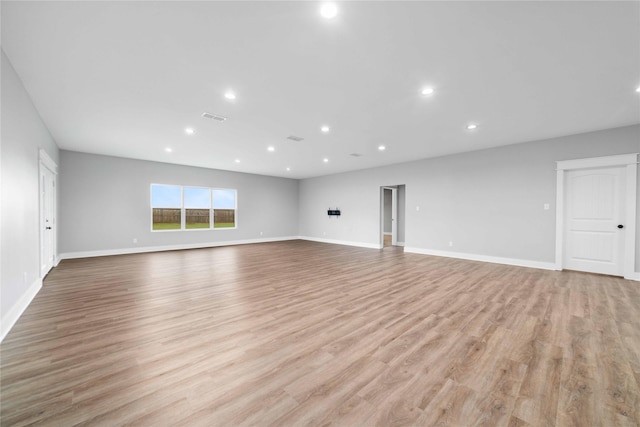 unfurnished living room with light wood-type flooring