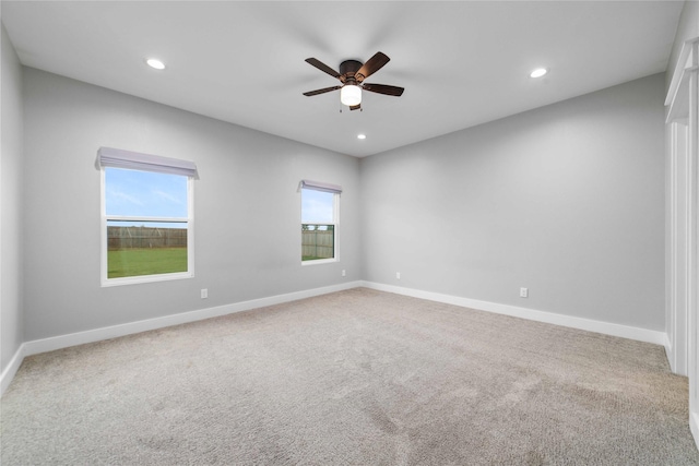 unfurnished room with ceiling fan and carpet floors