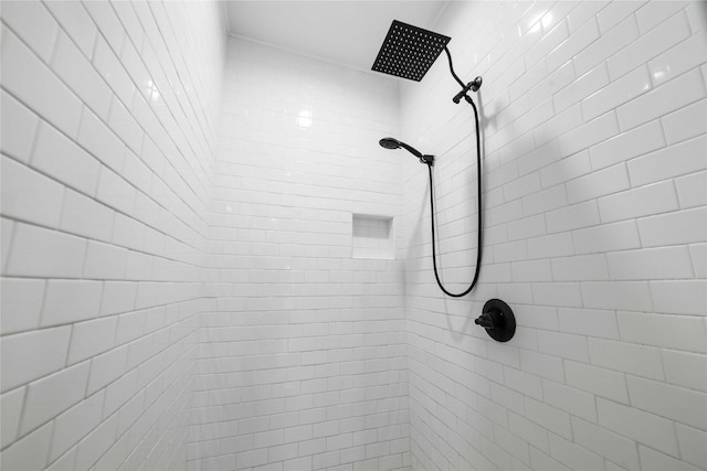 interior details with a tile shower