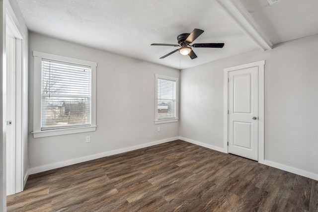 unfurnished room with dark hardwood / wood-style floors and ceiling fan