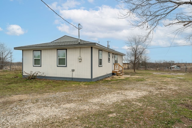 view of property exterior with a lawn