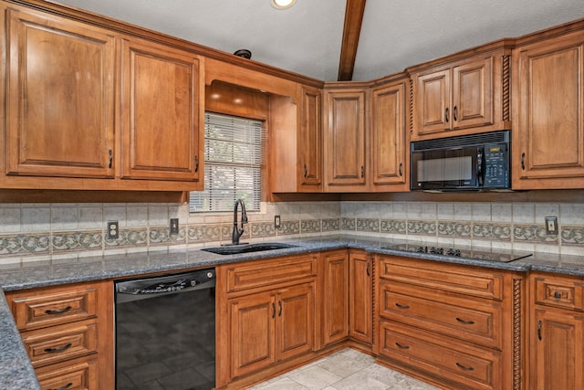 kitchen with sink, black appliances, dark stone countertops, beamed ceiling, and backsplash