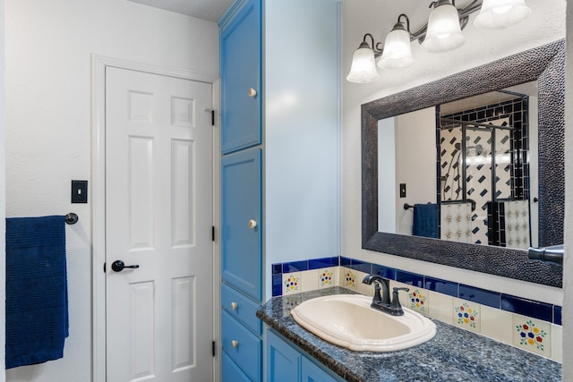 bathroom featuring walk in shower and vanity