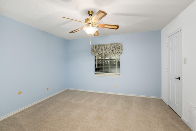 carpeted empty room with ceiling fan