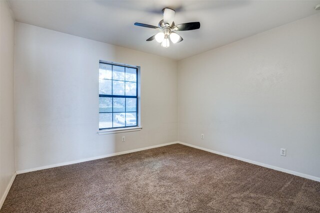 unfurnished room with carpet, a ceiling fan, and baseboards