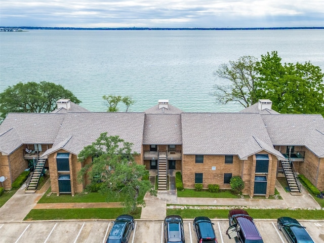 view of subject property with a nearby body of water