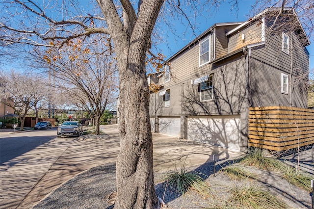 view of property exterior with a garage