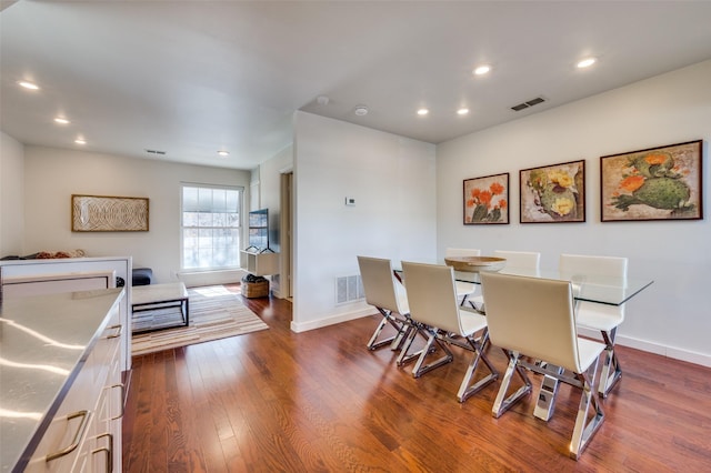 dining area featuring dark hardwood / wood-style flooring