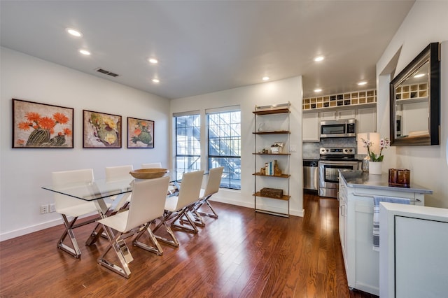 dining area featuring dark hardwood / wood-style flooring