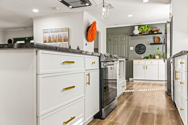 kitchen with crown molding, a textured ceiling, white cabinets, and light wood-type flooring