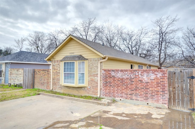 view of side of property with a patio