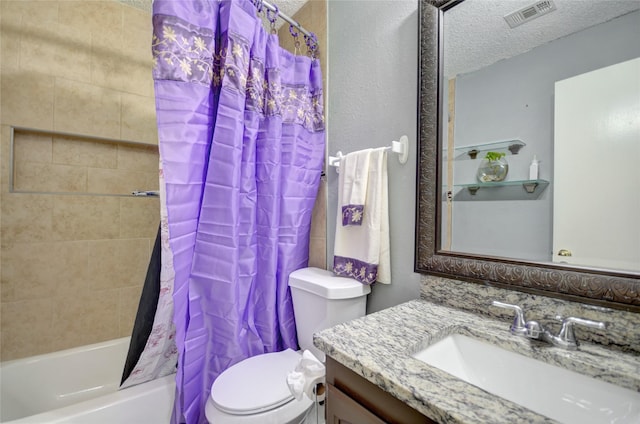 full bathroom featuring vanity, toilet, shower / tub combo, and a textured ceiling