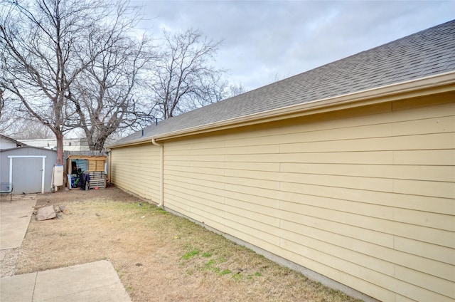 view of property exterior featuring a storage shed