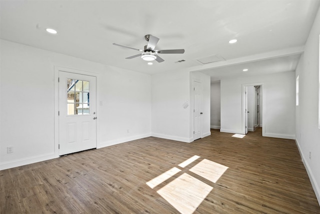 spare room with ceiling fan and dark hardwood / wood-style flooring