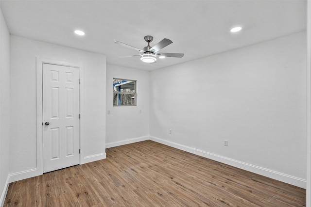 unfurnished room with light hardwood / wood-style flooring and ceiling fan