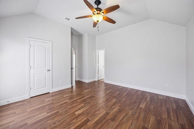 unfurnished bedroom featuring vaulted ceiling, dark hardwood / wood-style floors, and ceiling fan