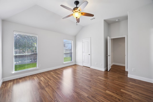 interior space featuring vaulted ceiling, dark hardwood / wood-style floors, and ceiling fan