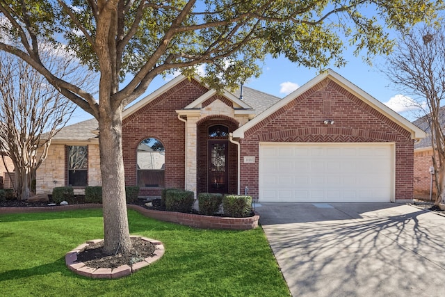 view of front of home with a garage and a front yard