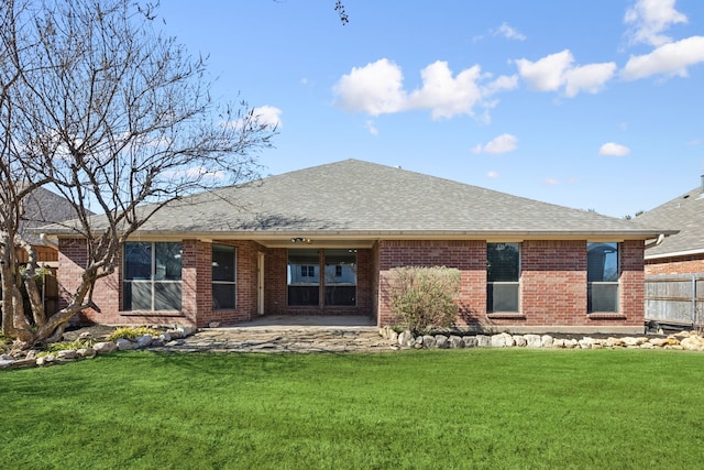 back of property with a patio and a lawn