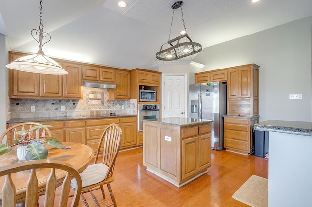 kitchen with a kitchen island, decorative light fixtures, decorative backsplash, stainless steel appliances, and light hardwood / wood-style flooring