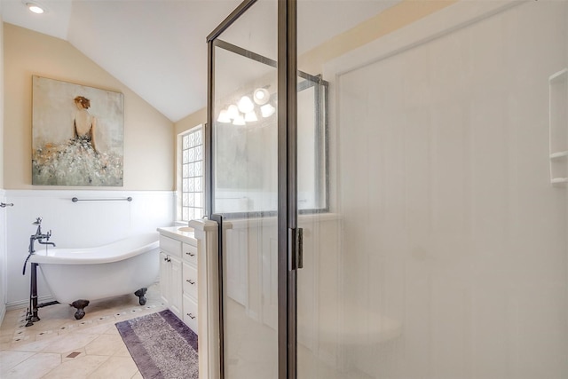 bathroom with tile patterned floors, vanity, independent shower and bath, and vaulted ceiling