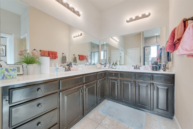 bathroom with tile patterned flooring, vanity, and a shower with shower door