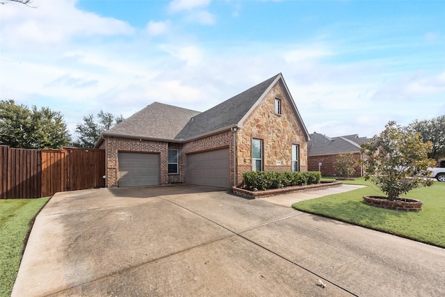 view of front of house with a garage and a front yard