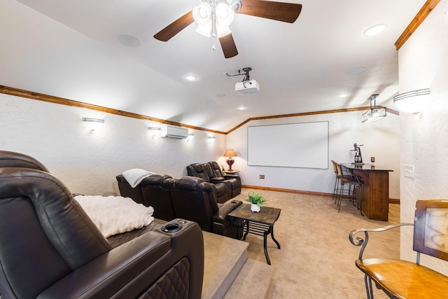 carpeted cinema room with ornamental molding, lofted ceiling, ceiling fan, and a wall unit AC