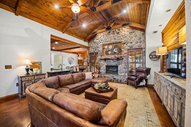 living room with beamed ceiling, ceiling fan, and wooden ceiling