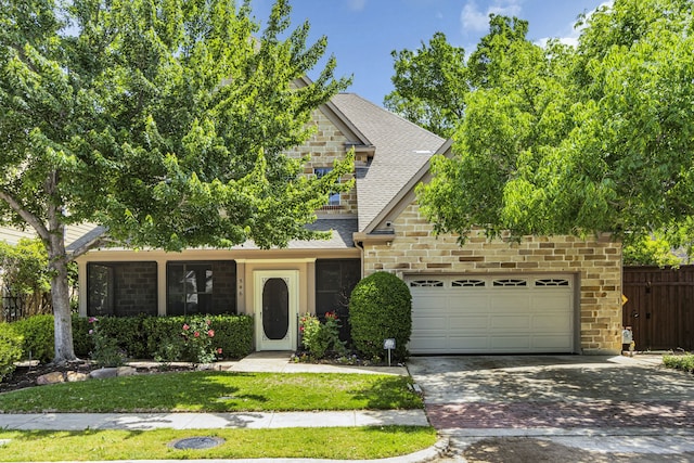 view of property hidden behind natural elements featuring a garage