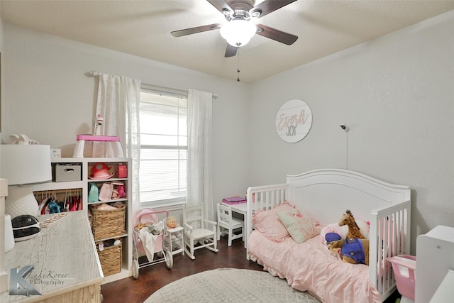 bedroom with dark wood-type flooring and ceiling fan