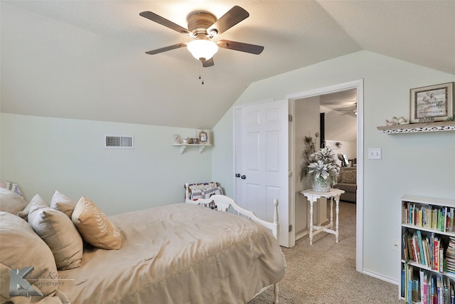 bedroom featuring light carpet, vaulted ceiling, and ceiling fan