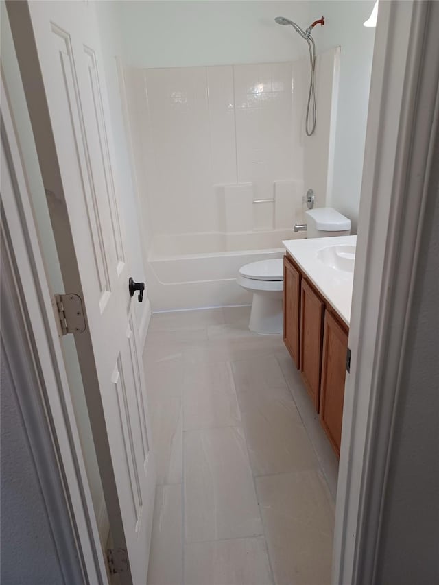 full bathroom with tile patterned flooring, vanity, tub / shower combination, and toilet