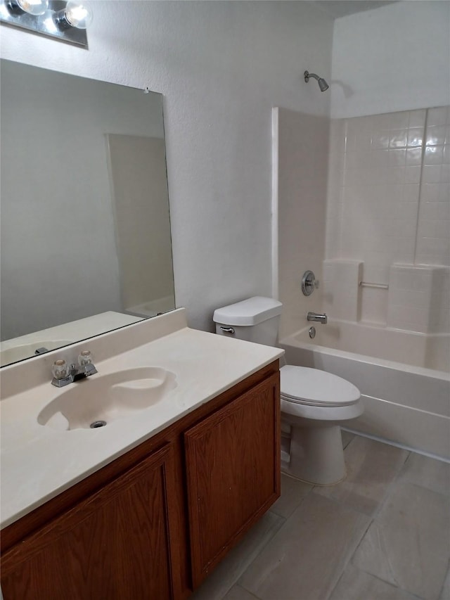 full bathroom featuring vanity, bathtub / shower combination, and toilet