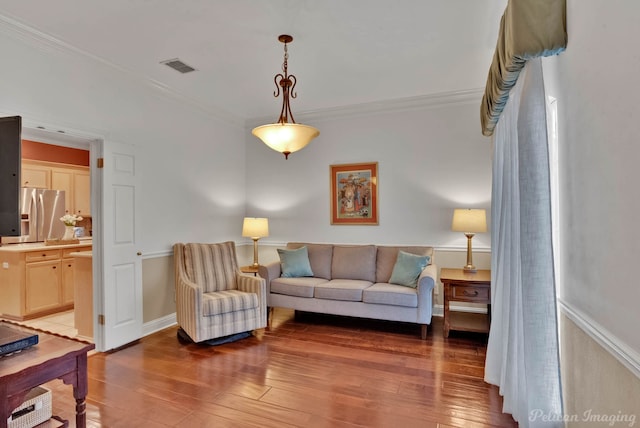 living room featuring crown molding and dark hardwood / wood-style floors