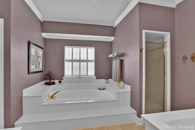 bathroom featuring independent shower and bath, ornamental molding, and tile patterned floors