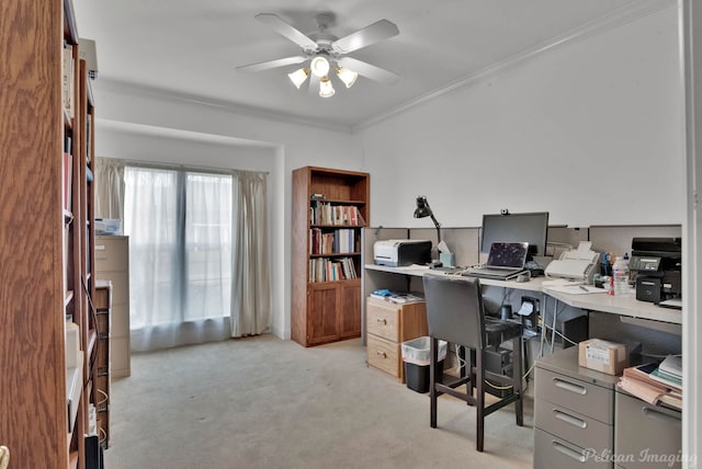 carpeted office space with crown molding and ceiling fan