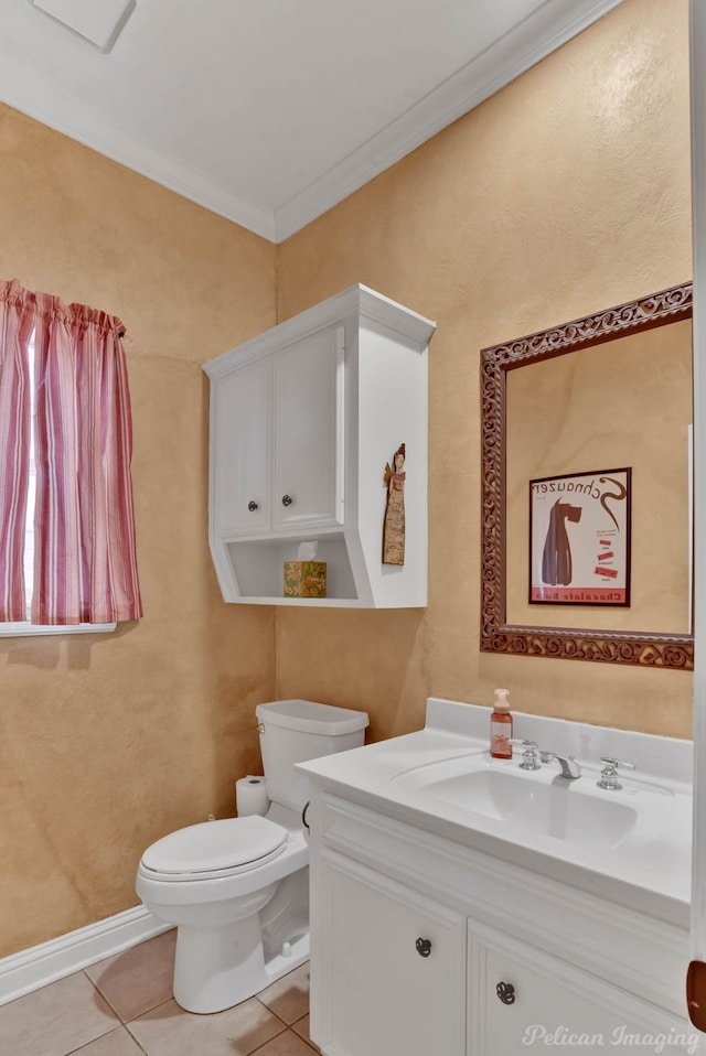 bathroom featuring crown molding, vanity, toilet, and tile patterned flooring