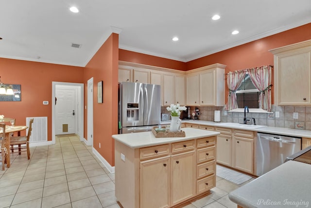 kitchen with light tile patterned flooring, sink, a center island, appliances with stainless steel finishes, and backsplash