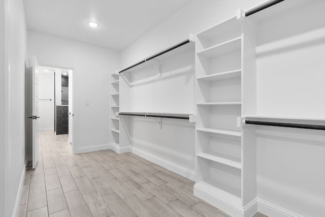 walk in closet featuring light wood-type flooring