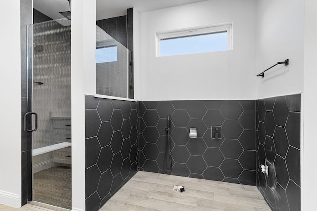 bathroom with tiled shower