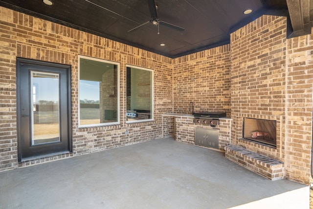 view of patio / terrace with ceiling fan and area for grilling