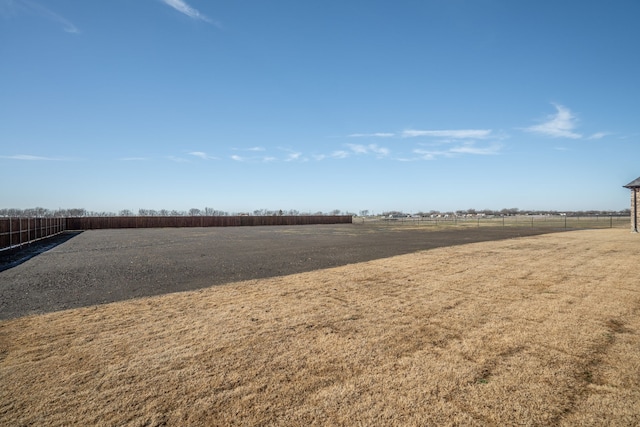 view of yard with a rural view