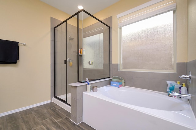 bathroom featuring plus walk in shower