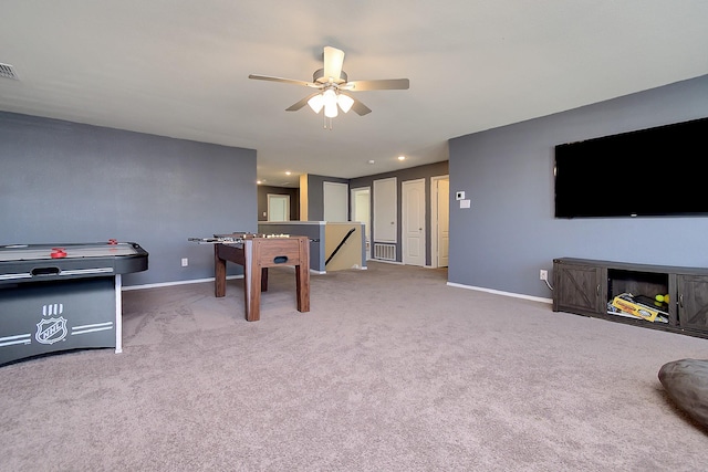 rec room with carpet flooring and ceiling fan