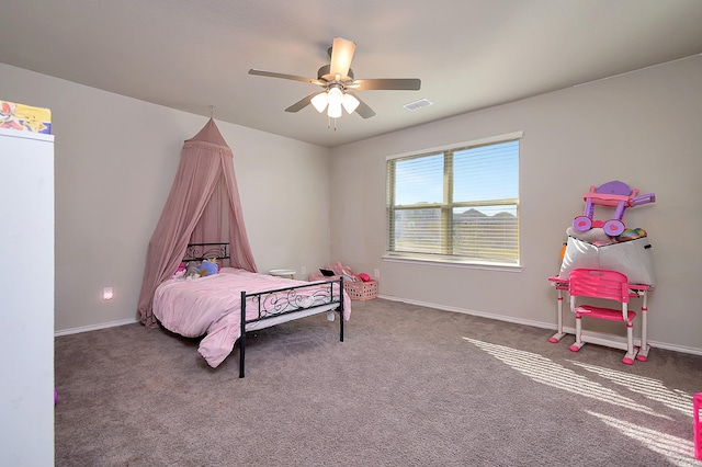 bedroom featuring ceiling fan and carpet