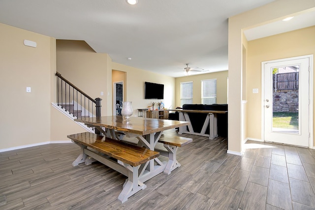 dining room featuring wood-type flooring and ceiling fan