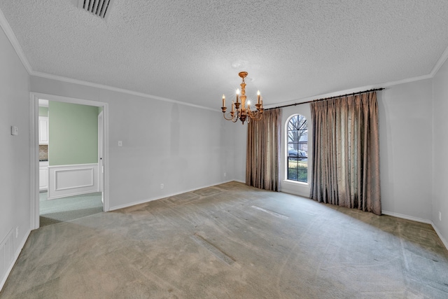 carpeted empty room featuring crown molding, a chandelier, and a textured ceiling