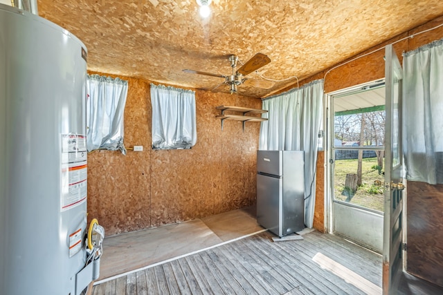 interior space featuring water heater and ceiling fan